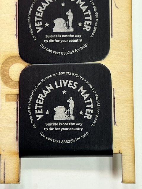 Custom-engraved "Veteran Lives Matter" coasters with the Veterans Crisis Line numbers, made by Let It Be Company